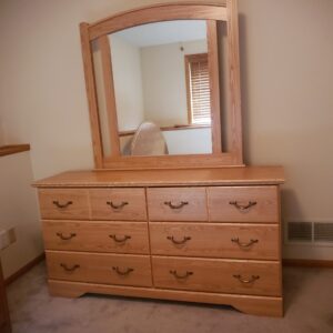 A bed and two dressers